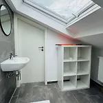 Charming Attic Retreat With Sloped Roof Apartment